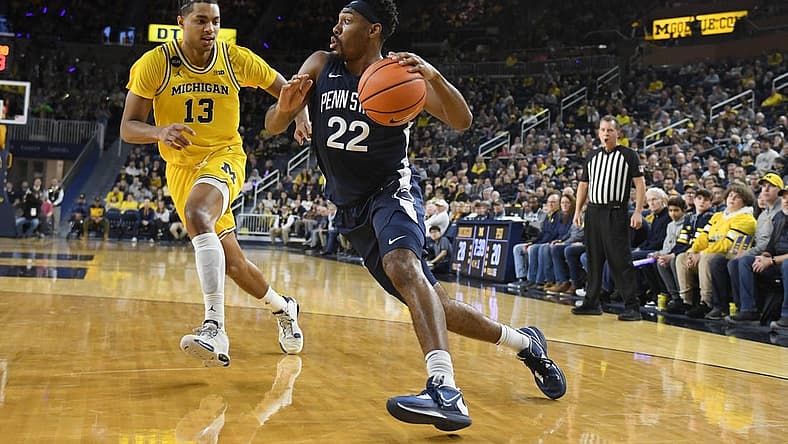 Jan 4, 2023; Ann Arbor, Michigan, USA; Penn State's Jalen Pickett (22) drive past Michigan's Jett Howard (13) in the first half at Crisler Center. Mandatory Credit: Lon Horwedel-USA TODAY Sports