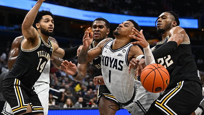 Jan 4, 2023; Washington, District of Columbia, USA; Georgetown Hoyas guard Primo Spears (1) is fouled by Villanova Wildcats forward Cam Whitmore (22) during the second half at Capital One Arena. Mandatory Credit: Brad Mills-USA TODAY Sports