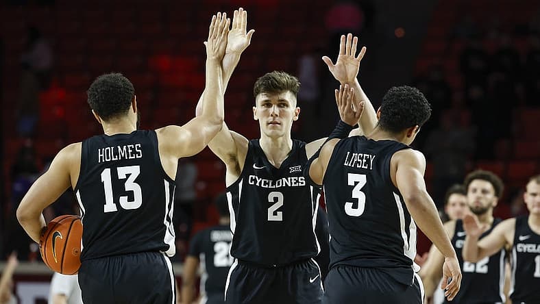 Jan 4, 2023; Norman, Oklahoma, USA; Iowa State Cyclones guard Caleb Grill (2) celebrates with guards Jaren Holmes (13) and Tamin Lipsey (3) after defeating the Oklahoma Sooners at Lloyd Noble Center. Mandatory Credit: Alonzo Adams-USA TODAY Sports