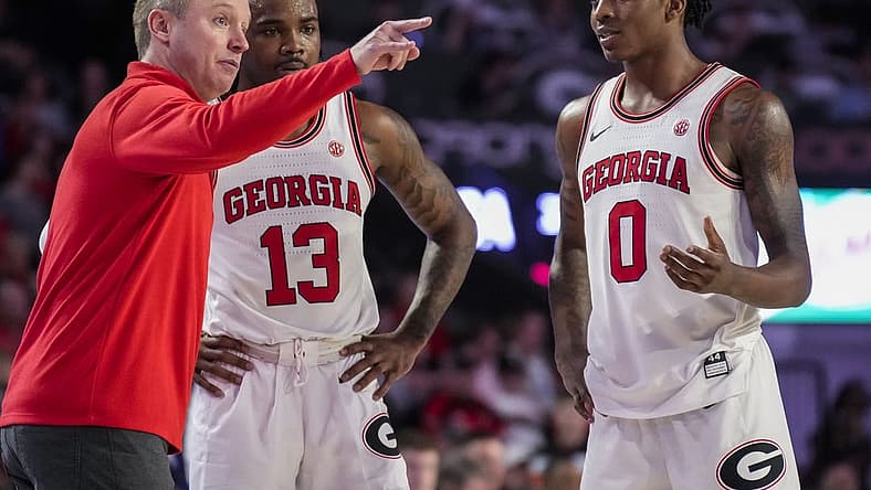 Jan 4, 2023; Athens, Georgia, USA; Georgia Bulldogs head coach Mike White coaches guards Mardrez McBride (13) and Terry Roberts (0) against the Auburn Tigers during the second half at Stegeman Coliseum. Mandatory Credit: Dale Zanine-USA TODAY Sports