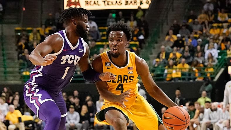Jan 4, 2023; Waco, Texas, USA; Baylor Bears guard LJ Cryer (4) drives to the basket against TCU Horned Frogs guard Mike Miles Jr. (1) during the first half at Ferrell Center. Mandatory Credit: Chris Jones-USA TODAY Sports