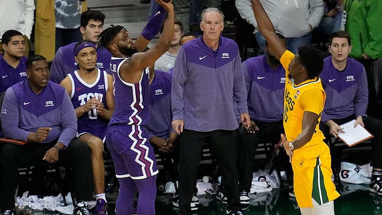 Jan 4, 2023; Waco, Texas, USA; TCU Horned Frogs guard Mike Miles Jr. (1) makes a three point basket against Baylor Bears forward Josh Ojianwuna (15) during the second half at Ferrell Center. Mandatory Credit: Chris Jones-USA TODAY Sports