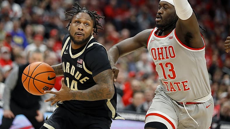 Jan 5, 2023; Columbus, Ohio, USA;  Purdue Boilermakers guard David Jenkins Jr. (14) drives past Ohio State Buckeyes guard Isaac Likekele (13) during the first half at Value City Arena. Mandatory Credit: Joseph Maiorana-USA TODAY Sports