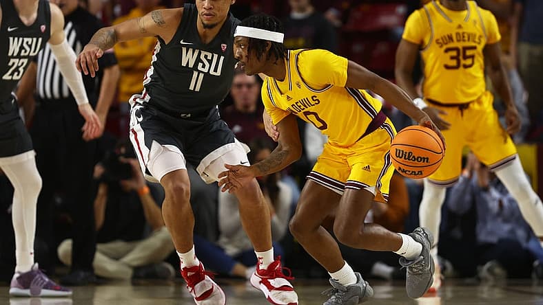 Jan 5, 2023; Tempe, Arizona, USA; Arizona State Sun Devils guard DJ Horne (0) against Washington State Cougars forward DJ Rodman (11) in the first half at Desert Financial Arena. Mandatory Credit: Mark J. Rebilas-USA TODAY Sports