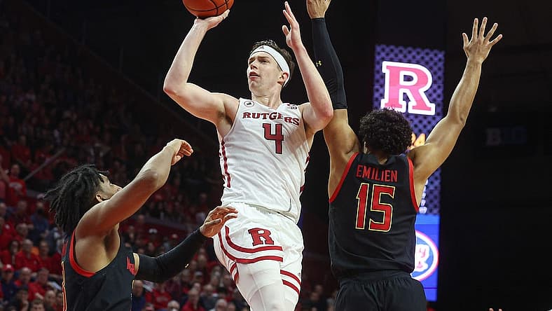 Jan 5, 2023; Piscataway, New Jersey, USA; Rutgers Scarlet Knights guard Paul Mulcahy (4) shoots the ball as Maryland Terrapins guard Ian Martinez (23) and forward Patrick Emilien (15) defends during the second half at Jersey Mike's Arena. Mandatory Credit: Vincent Carchietta-USA TODAY Sports