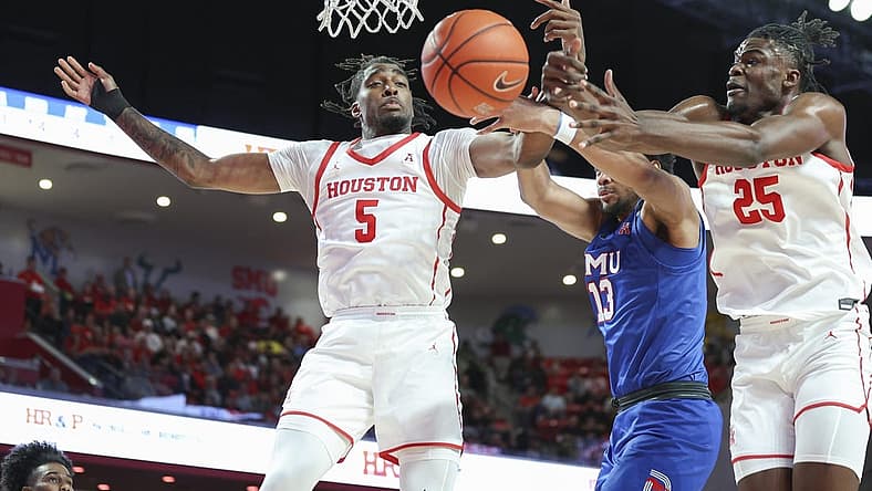 Jan 5, 2023; Houston, Texas, USA; Houston Cougars forward Ja'Vier Francis (5) and forward Jarace Walker (25) attempt to get the ball away from Southern Methodist Mustangs center Mo Njie (13) during the second half at Fertitta Center. Mandatory Credit: Troy Taormina-USA TODAY Sports