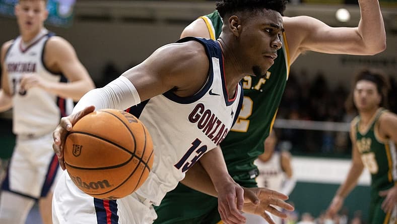 Jan 5, 2023; San Francisco, California, USA; Gonzaga Bulldogs guard Malachi Smith (13) drives the baseline past San Francisco Dons guard Julian Rishwain (2) during the first half at War Memorial at the Sobrato Center. Mandatory Credit: D. Ross Cameron-USA TODAY Sports