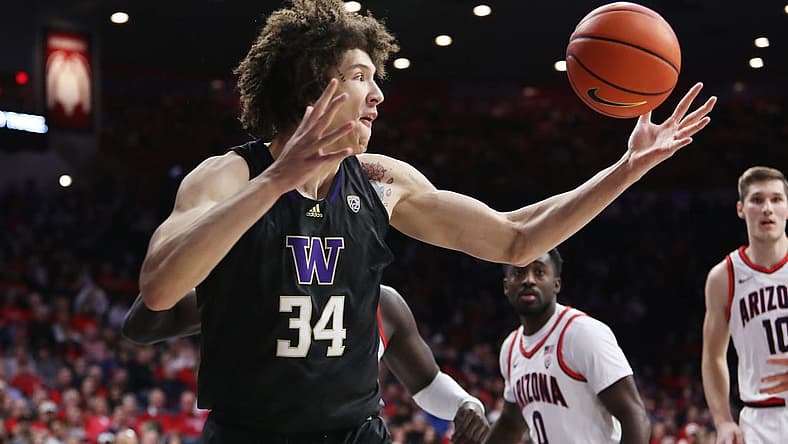 Jan 5, 2023; Tucson, Arizona, USA; Washington Huskies center Braxton Meah (34) gets a rebound in the first half at McKale Center. Mandatory Credit: Zachary BonDurant-USA TODAY Sports