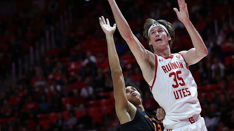 Jan 5, 2023; Salt Lake City, Utah, USA; Utah Utes center Branden Carlson (35) shoots the ball over Oregon State Beavers forward Michael Rataj (12) in the second half at Jon M. Huntsman Center. Mandatory Credit: Rob Gray-USA TODAY Sports