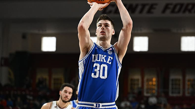 Jan 7, 2023; Chestnut Hill, Massachusetts, USA; Duke Blue Devils center Kyle Filipowski (30) attempts a free-throw against the Boston College Eagles during the first half at the Conte Forum. Mandatory Credit: Brian Fluharty-USA TODAY Sports