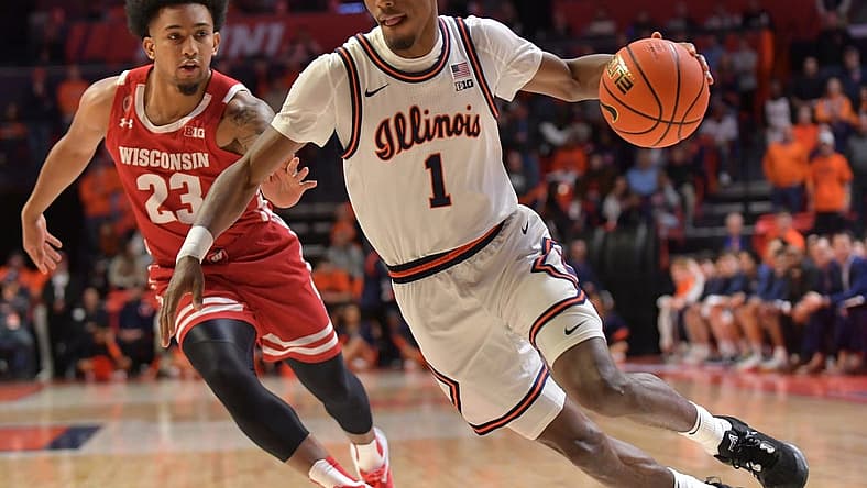 Jan 7, 2023; Champaign, Illinois, USA; Illinois Fighting Illini guard Sencire Harris (1) drives the ball past Wisconsin Badgers guard Chucky Hepburn (23) during the first half at State Farm Center. Mandatory Credit: Ron Johnson-USA TODAY Sports