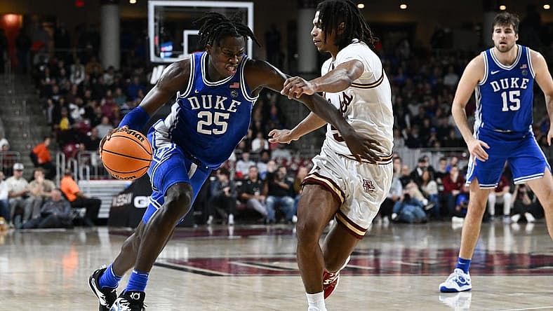 Jan 7, 2023; Chestnut Hill, Massachusetts, USA; Duke Blue Devils forward Mark Mitchell (25) drives to the basket against Boston College Eagles guard DeMarr Langford Jr. (5) during the second half at the Conte Forum. Mandatory Credit: Brian Fluharty-USA TODAY Sports