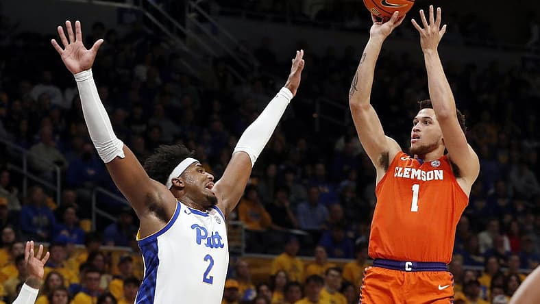 Jan 7, 2023; Pittsburgh, Pennsylvania, USA;  Clemson Tigers guard Chase Hunter (1) shoots against Pittsburgh Panthers forward Blake Hinson (2) during the first half at the Petersen Events Center. Mandatory Credit: Charles LeClaire-USA TODAY Sports