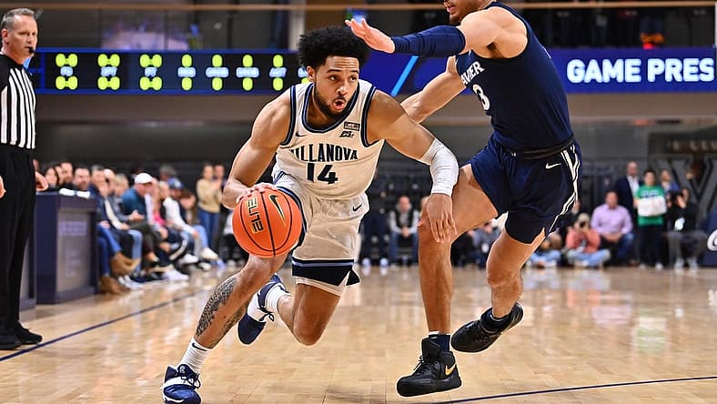 Jan 7, 2023; Villanova, Pennsylvania, USA; Villanova Wildcats guard Caleb Daniels (14) drives against Xavier Musketeers guard Colby Jones (3) in the first half at William B. Finneran Pavilion. Mandatory Credit: Kyle Ross-USA TODAY Sports
