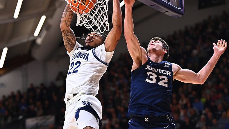 Jan 7, 2023; Villanova, Pennsylvania, USA; Villanova Wildcats forward Cam Whitmore (22) dunks over Xavier Musketeers forward Zach Freemantle (32) in the first half at William B. Finneran Pavilion. Mandatory Credit: Kyle Ross-USA TODAY Sports
