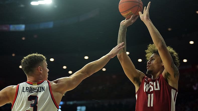 Jan 7, 2023; Tucson, Arizona, USA; Washington State Cougars forward DJ Rodman (11) shoots over Arizona Wildcats guard Pelle Larsson (3) during the first half at McKale Center. Mandatory Credit: Joe Camporeale-USA TODAY Sports
