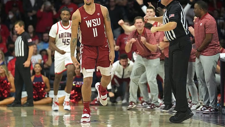 Jan 7, 2023; Tucson, Arizona, USA; The Washington State Cougars bench reacts after a three point basket by Washington State Cougars forward DJ Rodman (11) during the second half against the Arizona Wildcats at McKale Center. Mandatory Credit: Joe Camporeale-USA TODAY Sports