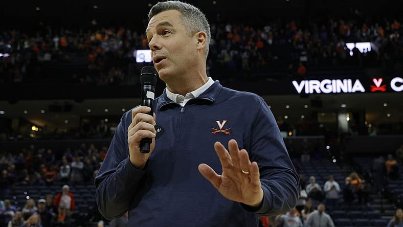 Jan 7, 2023; Charlottesville, Virginia, USA; Virginia Cavaliers head coach Tony Bennett (L) addresses the crowd after becoming the all-time winningest coach in men's basketball program history after the Cavaliers' game against the Syracuse Orange at John Paul Jones Arena. Mandatory Credit: Geoff Burke-USA TODAY Sports