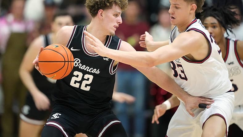 Jan 7, 2023; Santa Clara, California, USA; Santa Clara Broncos guard Brandin Podziemski (22) dribbles the ball against Gonzaga Bulldogs forward Ben Gregg (33) during the first half at Leavey Center. Mandatory Credit: Darren Yamashita-USA TODAY Sports