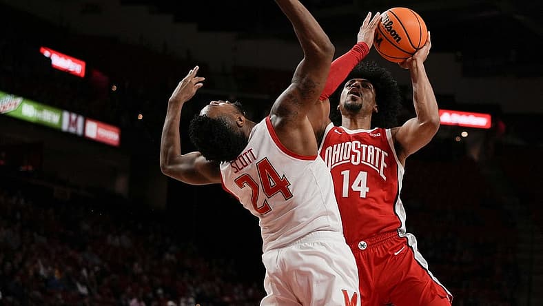 Jan 8, 2023; College Park, Maryland, USA; Ohio State Buckeyes forward Justice Sueing (14) shoots the ball while being guarded by Maryland Terrapins forward Donta Scott (24) in the first half at Xfinity Center. Mandatory Credit: Brent Skeen-USA TODAY Sports