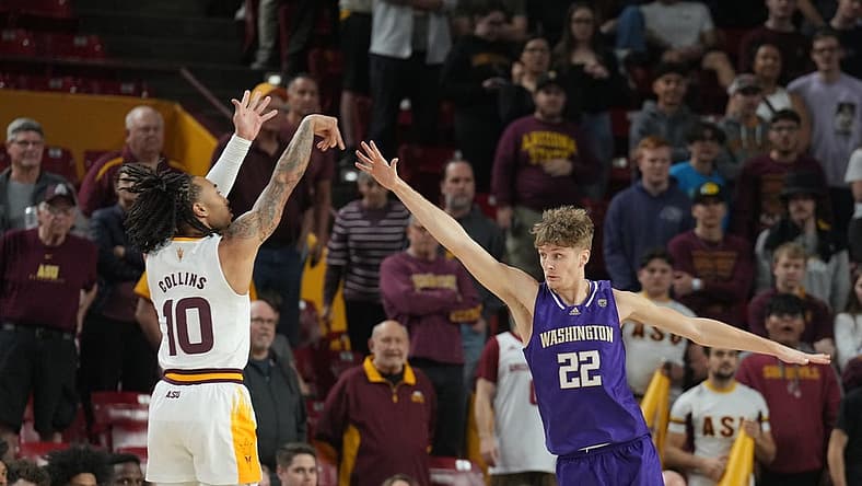 Jan 8, 2023; Tempe, Arizona, USA; Arizona State Sun Devils guard Frankie Collins (10) shoots against Washington Huskies guard Cole Bajema (22) during the first half at Desert Financial Arena. Mandatory Credit: Joe Camporeale-USA TODAY Sports
