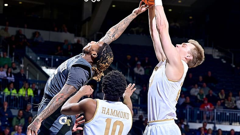 Jan 10, 2023; South Bend, Indiana, USA; Georgia Tech Yellow Jackets guard Deivon Smith (5) and Notre Dame Fighting Irish guard Dane Goodwin (23) reach for a rebound in the first half at the Purcell Pavilion. Mandatory Credit: Matt Cashore-USA TODAY Sports