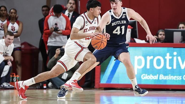 Jan 10, 2023; Queens, New York, USA;  St. John's Red Storm guard Rafael Pinzon (24) drives past Butler Bulldogs guard Simas Lukosius (41) in the first half at Carnesecca Arena. Mandatory Credit: Wendell Cruz-USA TODAY Sports