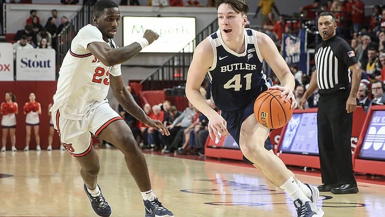 Jan 10, 2023; Queens, New York, USA; Butler Bulldogs guard Simas Lukosius (41) looks to drive past St. John's Red Storm forward David Jones (23) in the first half at Carnesecca Arena. Mandatory Credit: Wendell Cruz-USA TODAY Sports