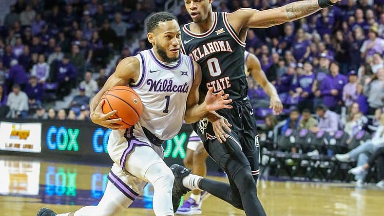 Jan 10, 2023; Manhattan, Kansas, USA; Kansas State Wildcats guard Markquis Nowell (1) drives to the basket against Oklahoma State Cowboys guard Avery Anderson III (0) during the first half at Bramlage Coliseum. Mandatory Credit: Scott Sewell-USA TODAY Sports