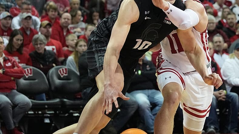 Michigan State forward Joey Hauser (10) Dave past Wisconsin guard Max Klesmit (11) during the first half of their game Tuesday, January 10, 2023 at the Kohl Center in Madison, Wis.
Uwmen10 1
