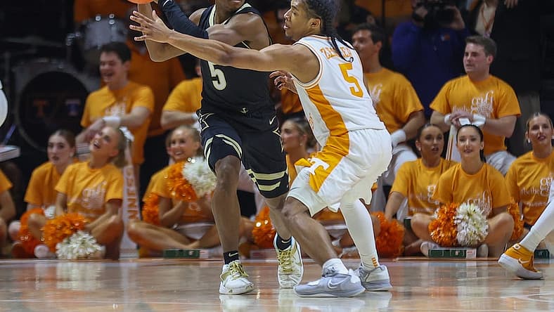Jan 10, 2023; Knoxville, Tennessee, USA; Vanderbilt Commodores guard Ezra Manjon (5) moves the ball against Tennessee Volunteers guard Zakai Zeigler (5) during the first half at Thompson-Boling Arena. Mandatory Credit: Randy Sartin-USA TODAY Sports