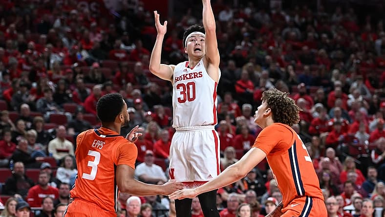 Jan 10, 2023; Lincoln, Nebraska, USA; Nebraska Cornhuskers guard Keisei Tominaga (30) scores over Illinois Fighting Illini guard Jayden Epps (3) in the first half at Pinnacle Bank Arena. Mandatory Credit: Steven Branscombe-USA TODAY Sports