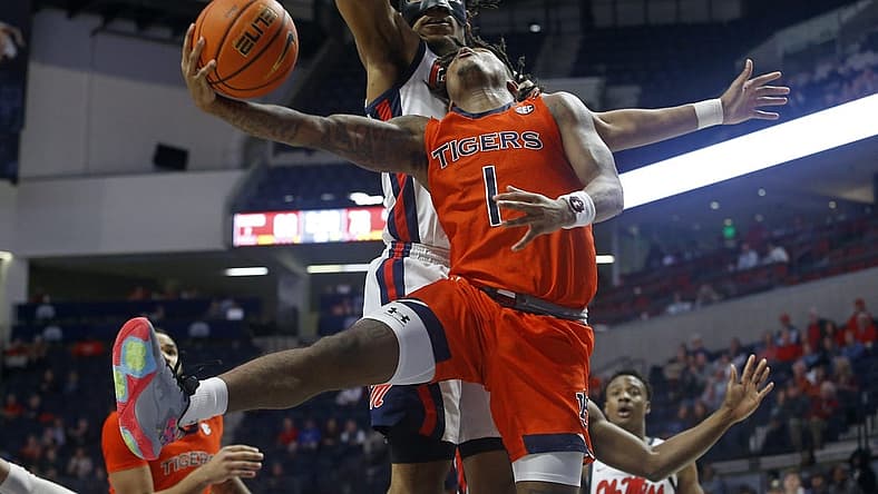 Jan 10, 2023; Oxford, Mississippi, USA; Auburn Tigers guard Wendell Green Jr. (1) drives to the basket as Mississippi Rebels forward Jayveous McKinnis (0) defends during the second half at The Sandy and John Black Pavilion at Ole Miss. Mandatory Credit: Petre Thomas-USA TODAY Sports