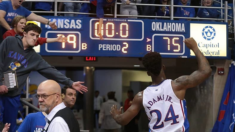 Kansas sophomore guard KJ Adams Jr. (24) pumps his arms up as he leaves Allen Fieldhouse after defeating Oklahoma 79-75 Tuesday night.