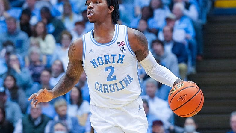 Jan 7, 2023; Chapel Hill, North Carolina, USA;  North Carolina Tar Heels guard Caleb Love (2) dribbles the ball against the Notre Dame Fighting Irish during the second half at Dean E. Smith Center. Mandatory Credit: James Guillory-USA TODAY Sports