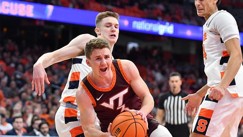 Jan 11, 2023; Syracuse, New York, USA; Virginia Tech Hokies guard Sean Pedulla (3) reacts to a foul by Syracuse Orange guard Justin Taylor (behind) in the first half at JMA Wireless Dome. Mandatory Credit: Mark Konezny-USA TODAY Sports