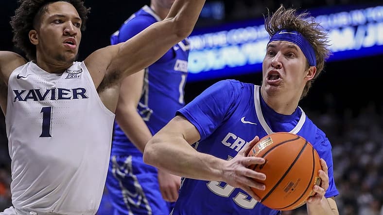 Jan 11, 2023; Cincinnati, Ohio, USA; Creighton Bluejays guard Baylor Scheierman (55) drives to the basket against Xavier Musketeers guard Desmond Claude (1) in the first half at Cintas Center. Mandatory Credit: Katie Stratman-USA TODAY Sports