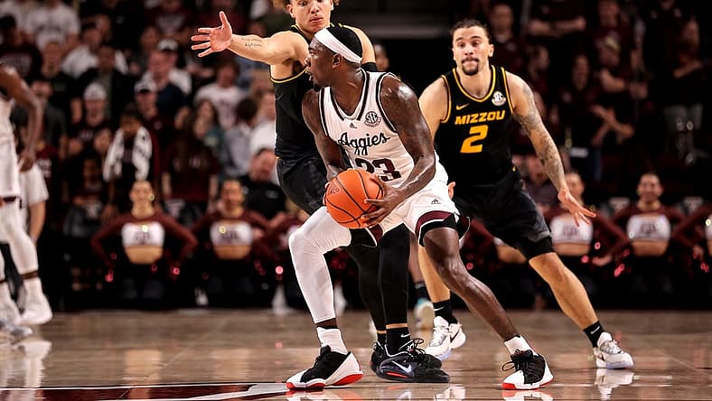 Jan 11, 2023; College Station, Texas, USA; Texas A&M Aggies guard Tyrece Radford (23) looks to pass the ball while Missouri Tigers forward Noah Carter (35) defends during the first half at Reed Arena. Mandatory Credit: Erik Williams-USA TODAY Sports