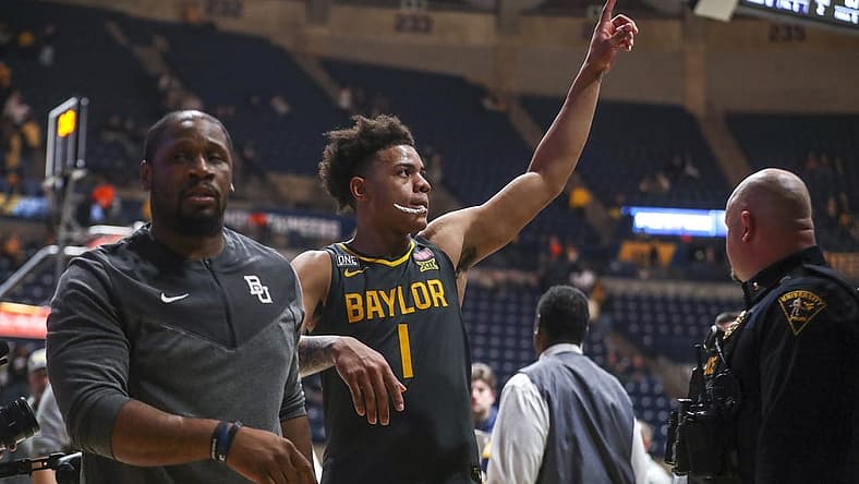 Jan 11, 2023; Morgantown, West Virginia, USA; Baylor Bears guard Keyonte George (1) celebrates after defeating the West Virginia Mountaineers at WVU Coliseum. Mandatory Credit: Ben Queen-USA TODAY Sports