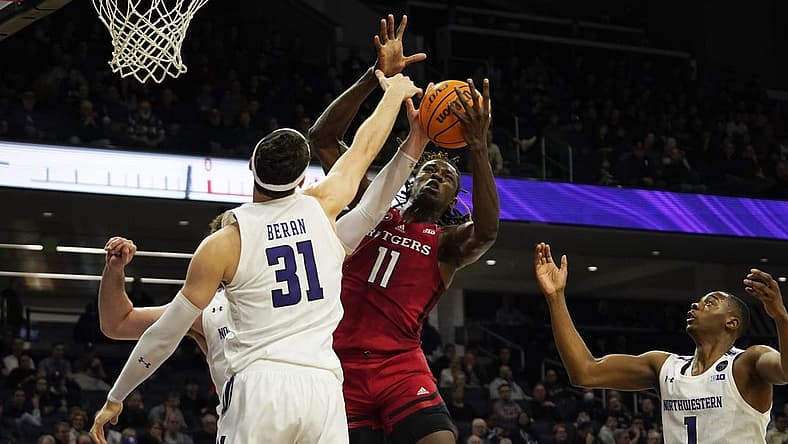 Jan 11, 2023; Evanston, Illinois, USA; Northwestern Wildcats forward Robbie Beran (31) defends Rutgers Scarlet Knights center Clifford Omoruyi (11) during the first half at Welsh-Ryan Arena. Mandatory Credit: David Banks-USA TODAY Sports