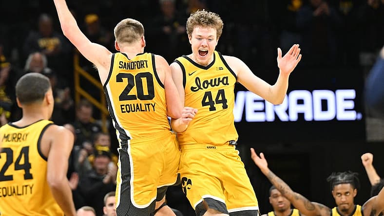 Jan 12, 2023; Iowa City, Iowa, USA; Iowa Hawkeyes forward Riley Mulvey (44) and forward Payton Sandfort (20) react after the game against the Michigan Wolverines at Carver-Hawkeye Arena. Mandatory Credit: Jeffrey Becker-USA TODAY Sports