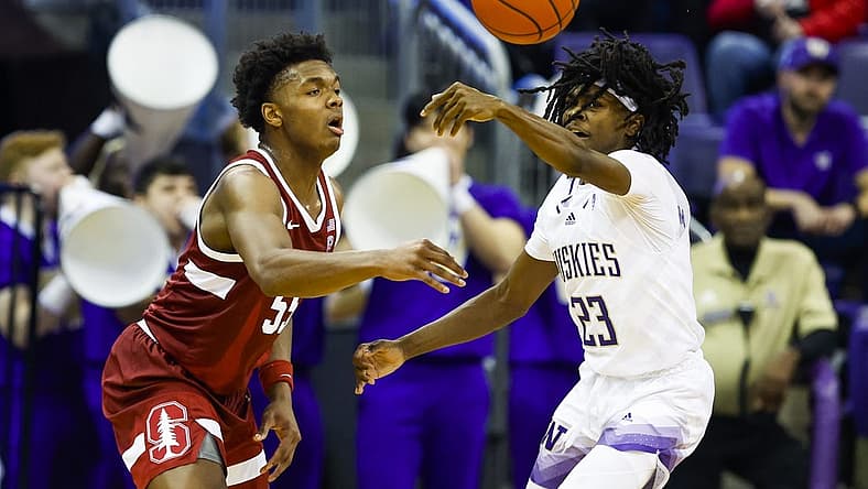 Jan 12, 2023; Seattle, Washington, USA; Washington Huskies guard Keyon Menifield (23) steals a pass from Stanford Cardinal forward Harrison Ingram (55) during the first half at Alaska Airlines Arena at Hec Edmundson Pavilion. Mandatory Credit: Joe Nicholson-USA TODAY Sports