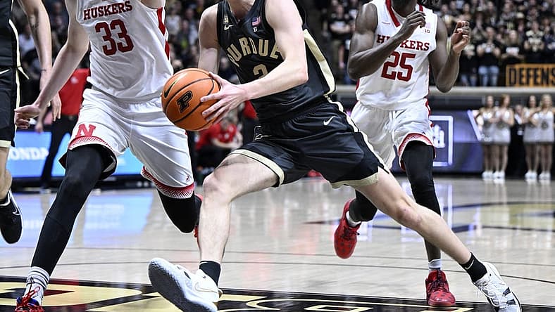 Jan 13, 2023; West Lafayette, Indiana, USA; Purdue Boilermakers guard Fletcher Loyer (2) runs into Nebraska Cornhuskers forward Oleg Kojenets (33) while driving toward the basket during the second half at Mackey Arena. Boilermakers won 73 to 55. Mandatory Credit: Marc Lebryk-USA TODAY Sports