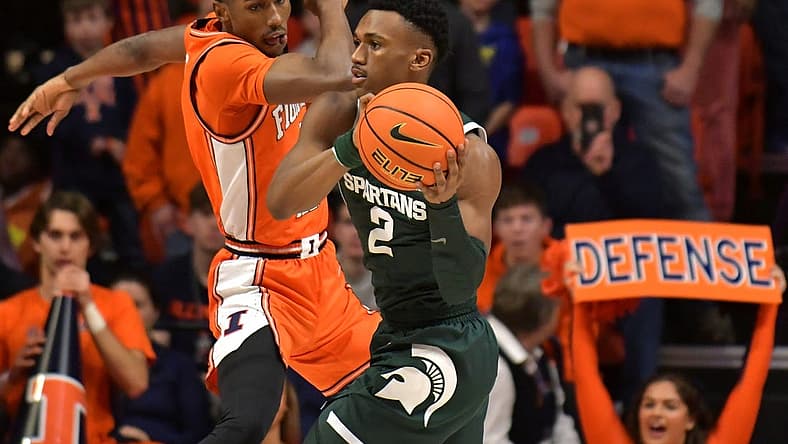 Jan 13, 2023; Champaign, Illinois, USA; Michigan State Spartans guard Tyson Walker (2) looks to pass as Illinois Fighting Illini guard Sencire Harris (1) defends during the first half at State Farm Center. Mandatory Credit: Ron Johnson-USA TODAY Sports