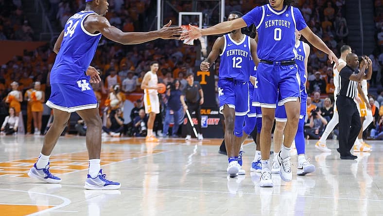 Jan 14, 2023; Knoxville, Tennessee, USA; Kentucky Wildcats forward Oscar Tshiebwe (34) and forward Jacob Toppin (0) react after a play against the Tennessee Volunteers during the first half at Thompson-Boling Arena. Mandatory Credit: Randy Sartin-USA TODAY Sports