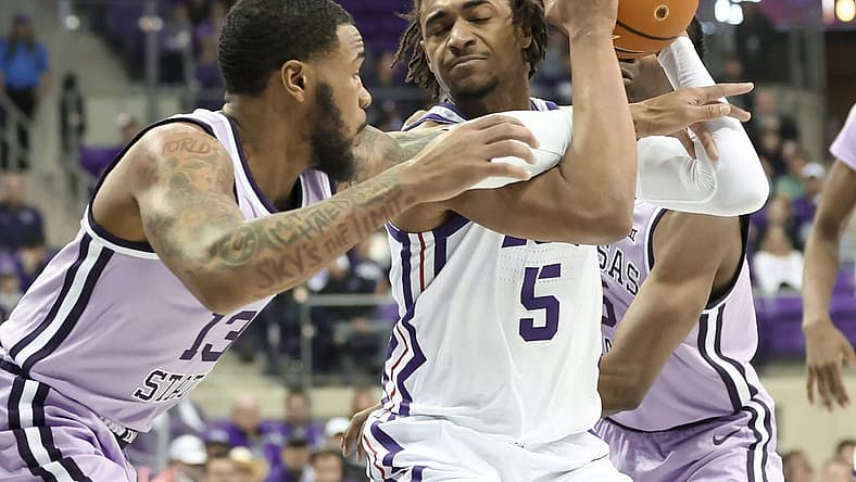 Jan 14, 2023; Fort Worth, Texas, USA; TCU Horned Frogs forward Chuck O'Bannon Jr. (5) tries to control the ball as Kansas State Wildcats guard Desi Sills (13) and Kansas State Wildcats guard Cam Carter (5) defend during the first half at Ed and Rae Schollmaier Arena. Mandatory Credit: Kevin Jairaj-USA TODAY Sports