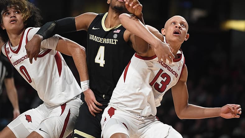 Jan 14, 2023; Nashville, Tennessee, USA; Vanderbilt Commodores guard Jordan Wright (4) battles with Arkansas Razorbacks guard Jordan Walsh (13) and guard Anthony Black (0) for a rebound during the first half at Memorial Gymnasium. Mandatory Credit: Christopher Hanewinckel-USA TODAY Sports