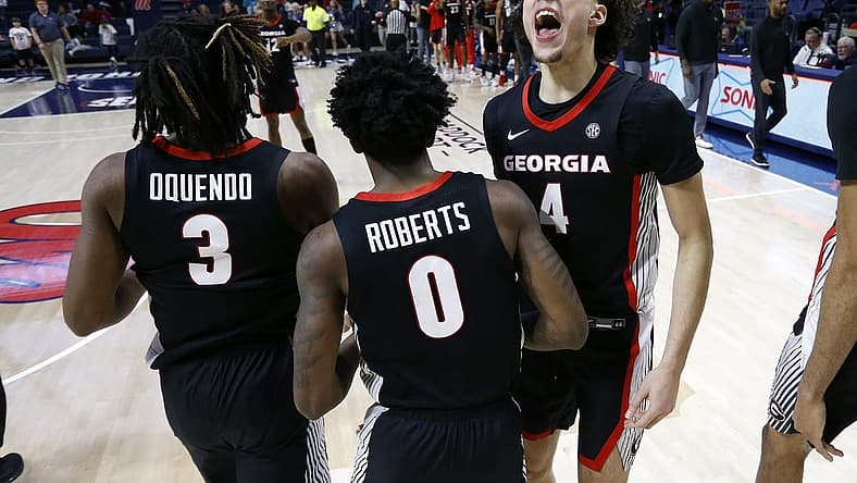 Jan 14, 2023; Oxford, Mississippi, USA; Georgia Bulldogs guard Jusaun Holt (4) reacts with Georgia Bulldogs guard Kario Oquendo (3) and Georgia Bulldogs guard Terry Roberts (0) after defeating the Mississippi Rebels at The Sandy and John Black Pavilion at Ole Miss. Mandatory Credit: Petre Thomas-USA TODAY Sports