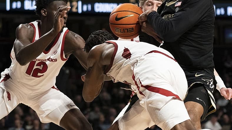 Jan 14, 2023; Nashville, Tennessee, USA;
Arkansas Razorbacks guard Davonte Davis (4) tries to take the ball from Vanderbilt Commodores guard Tyrin Lawrence (0) during the second half at Memorial Gymnasium. Mandatory Credit: George Walker IV - USA TODAY Sports