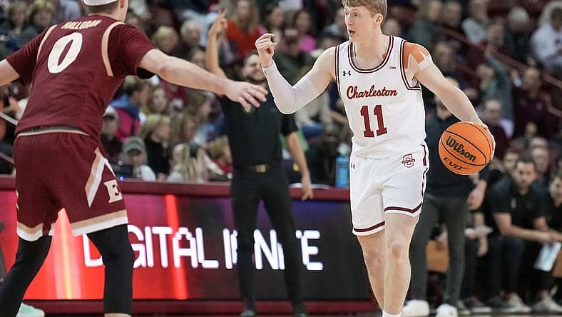 Jan 14, 2023; Charleston, South Carolina, USA; Charleston Cougars guard Ryan Larson (11) directs traffic in the first half against the Elon Phoenix at TD Arena. Mandatory Credit: David Yeazell-USA TODAY Sports